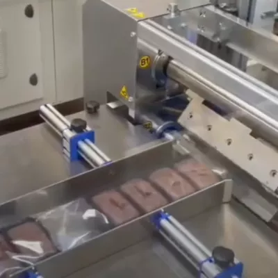 ADPAK SMIPACK FW550E wrapping chocolate cake at 50ppm