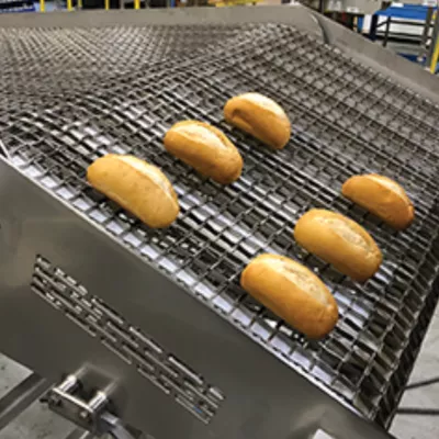 Pivoting wire mesh belt "dump conveyor" for bakery rejects