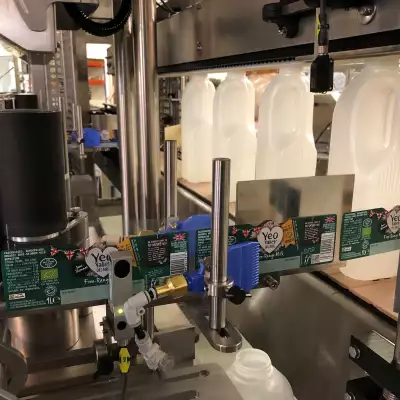 Sovereign Labelling Machines – 3 panel labelling – milk bottles