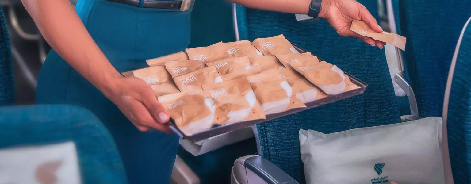Oman Air introduces recyclable paper packaging for economy class earphones