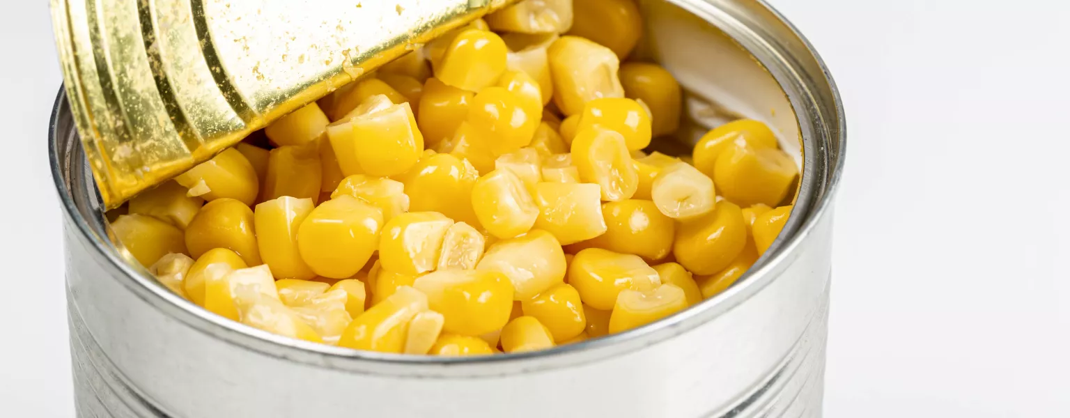 Open tin can with corn kernels on white background credit Marco Verch CC BY 2.0