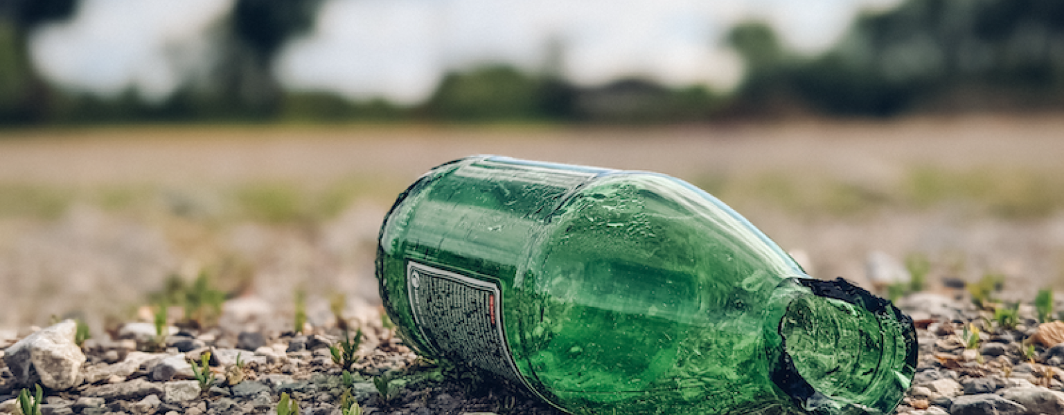 Close-up of a broken glass bottle on the ground. Glass being dumped instead of recycled credit Ivan Radic